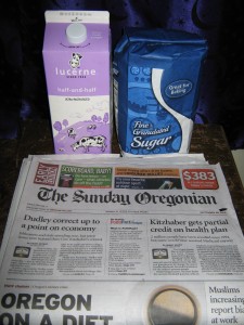 Sugar, half & half, newspaper